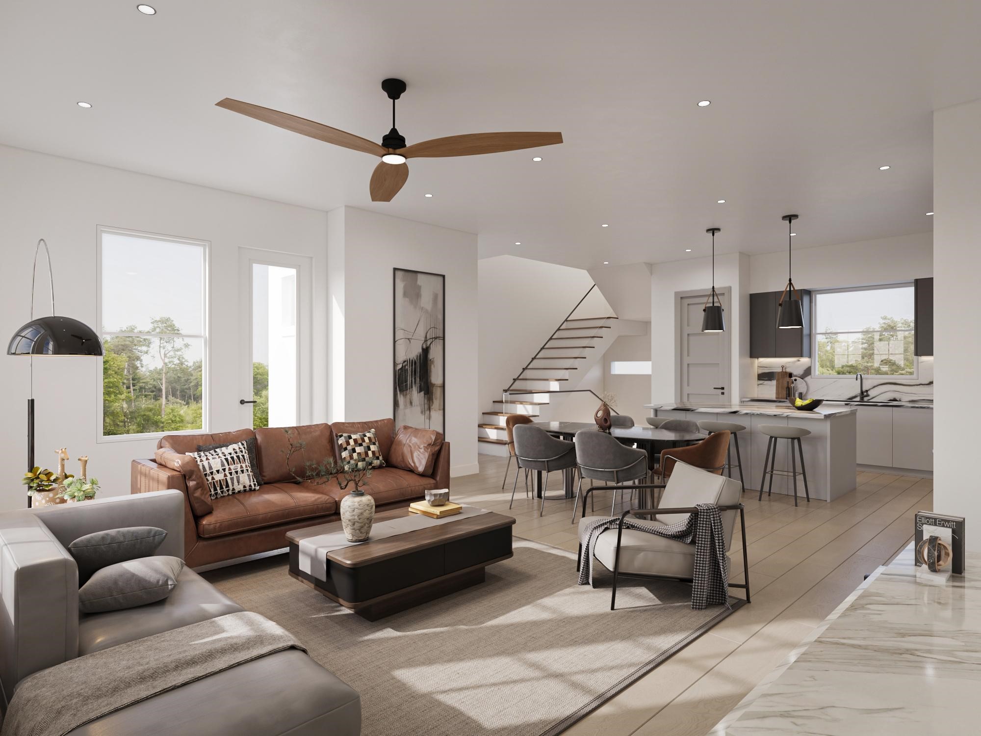 0 Mansfield Street Houston, TX 77091 - Photo 12 of 21 This is a modern, open-concept living space with a combined living room and kitchen. It features a stylish interior with contemporary furniture, a neutral color palette, and natural light. The kitchen includes a central island with seating. There's a staircase to the upper level, adding architectural interest.