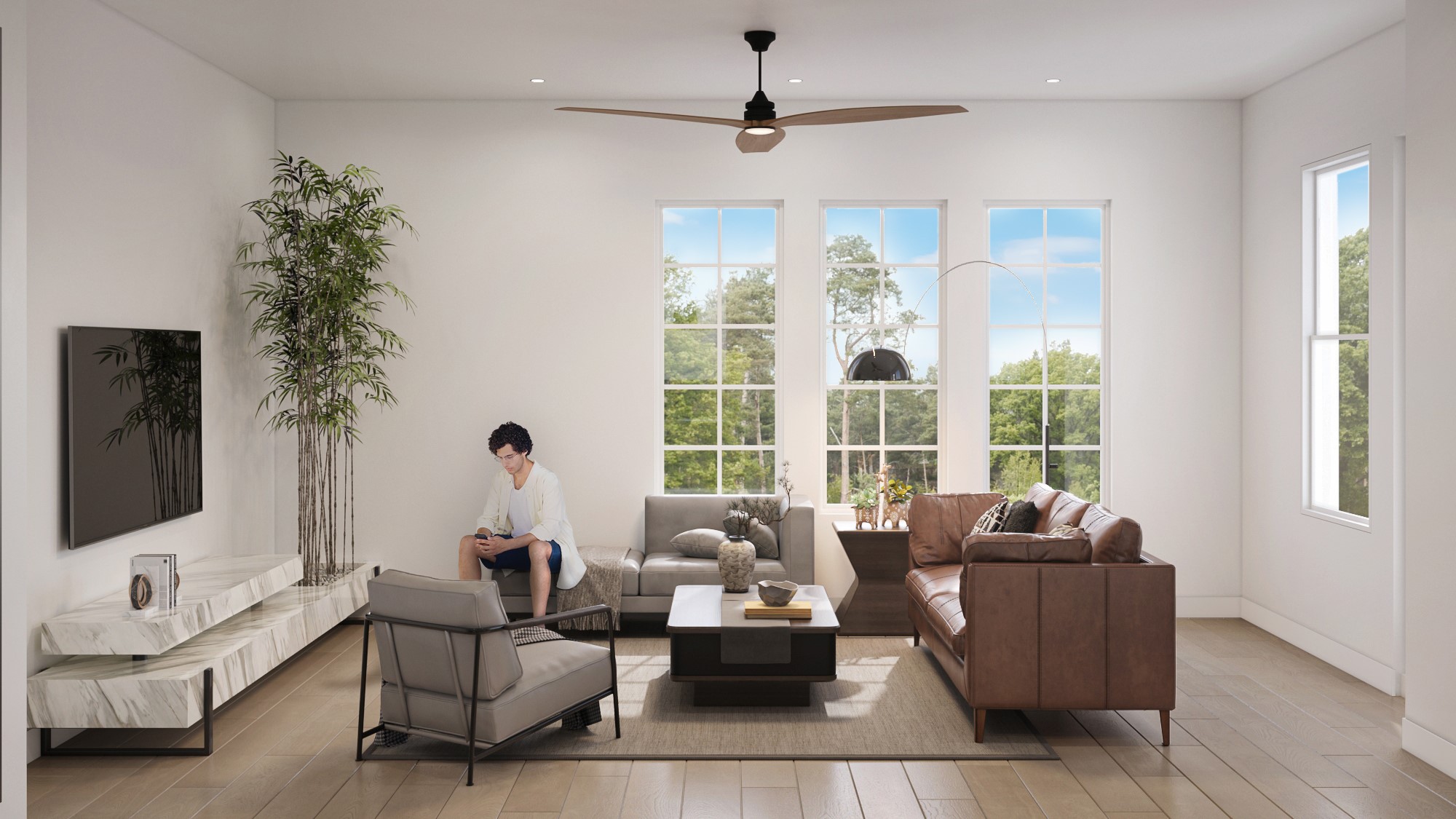 0 Mansfield Street Houston, TX 77091 - Photo 13 of 21 This is a bright, modern living room featuring large windows, contemporary furniture, and a ceiling fan, providing a comfortable and airy space with a view of greenery outside.