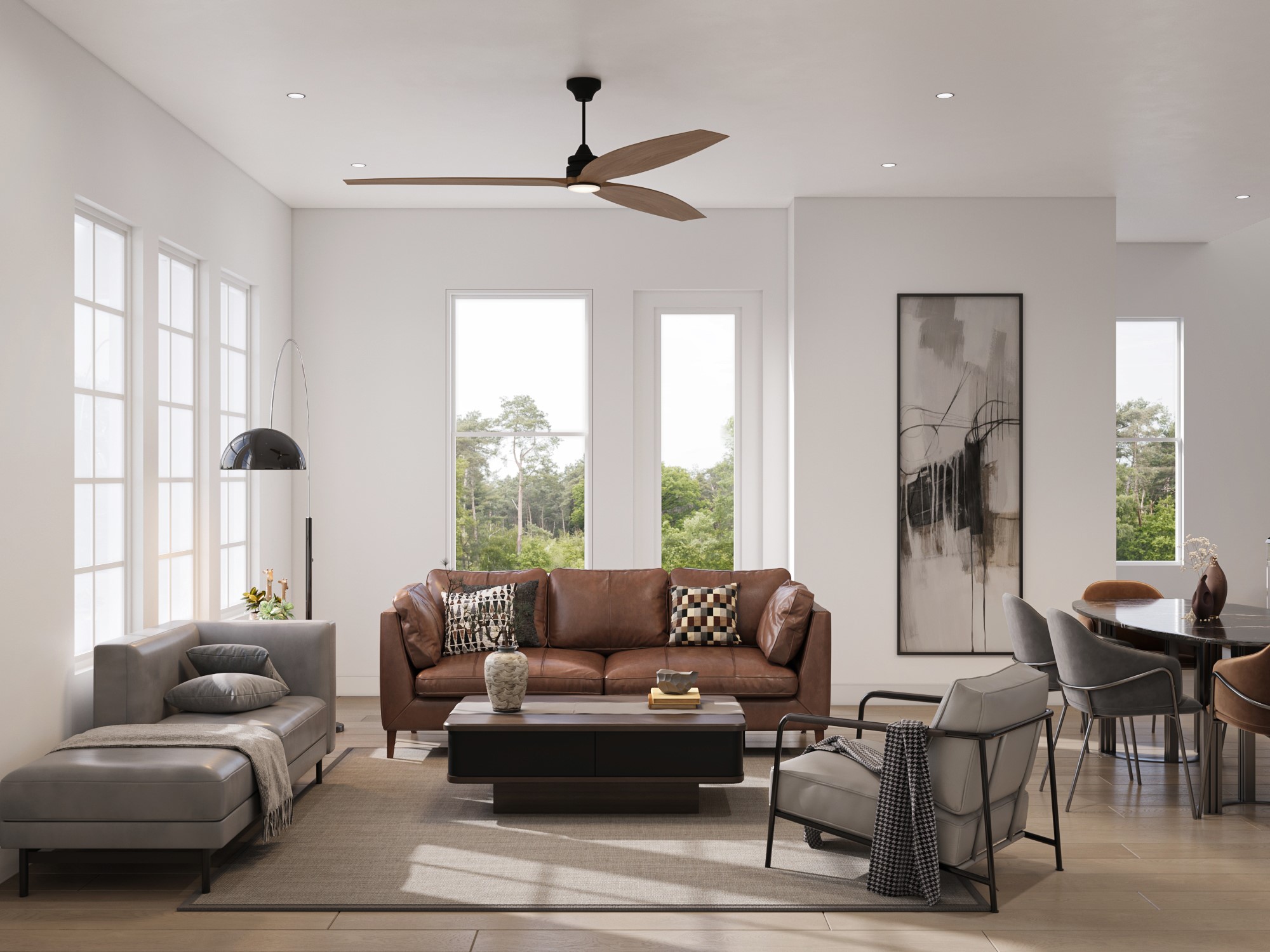 0 Mansfield Street Houston, TX 77091 - Photo 15 of 21 This is a modern, open-plan living space with ample natural light, featuring a comfortable seating area with a brown leather sofa and stylish chairs, a sleek ceiling fan, and a dining area in the background. The room is accented with contemporary artwork and overlooks a serene, wooded landscape.