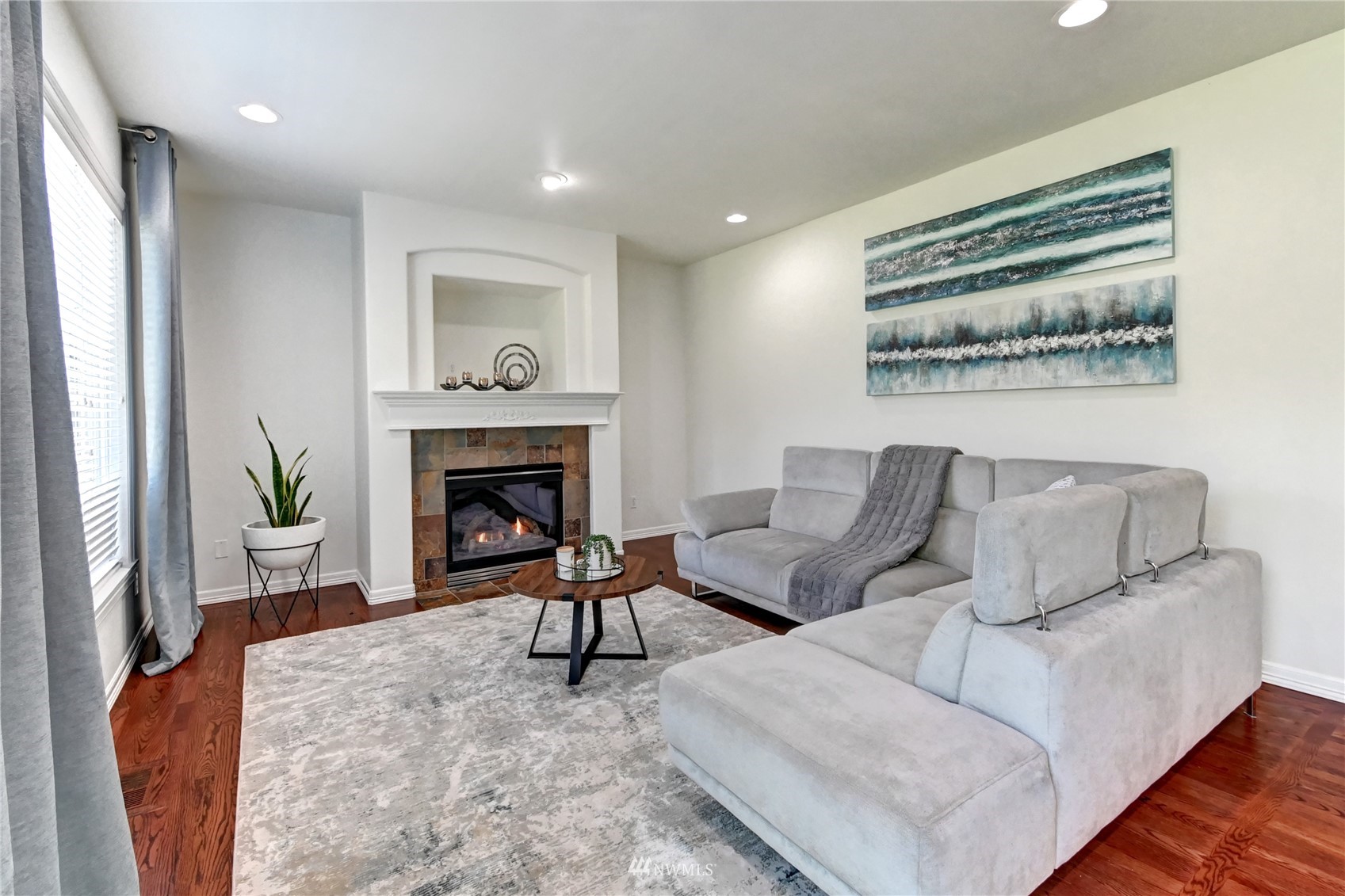 914 Southwest 361st Street Federal Way, WA 98023 - Photo 11 of 40 a living room with furniture and a fireplace