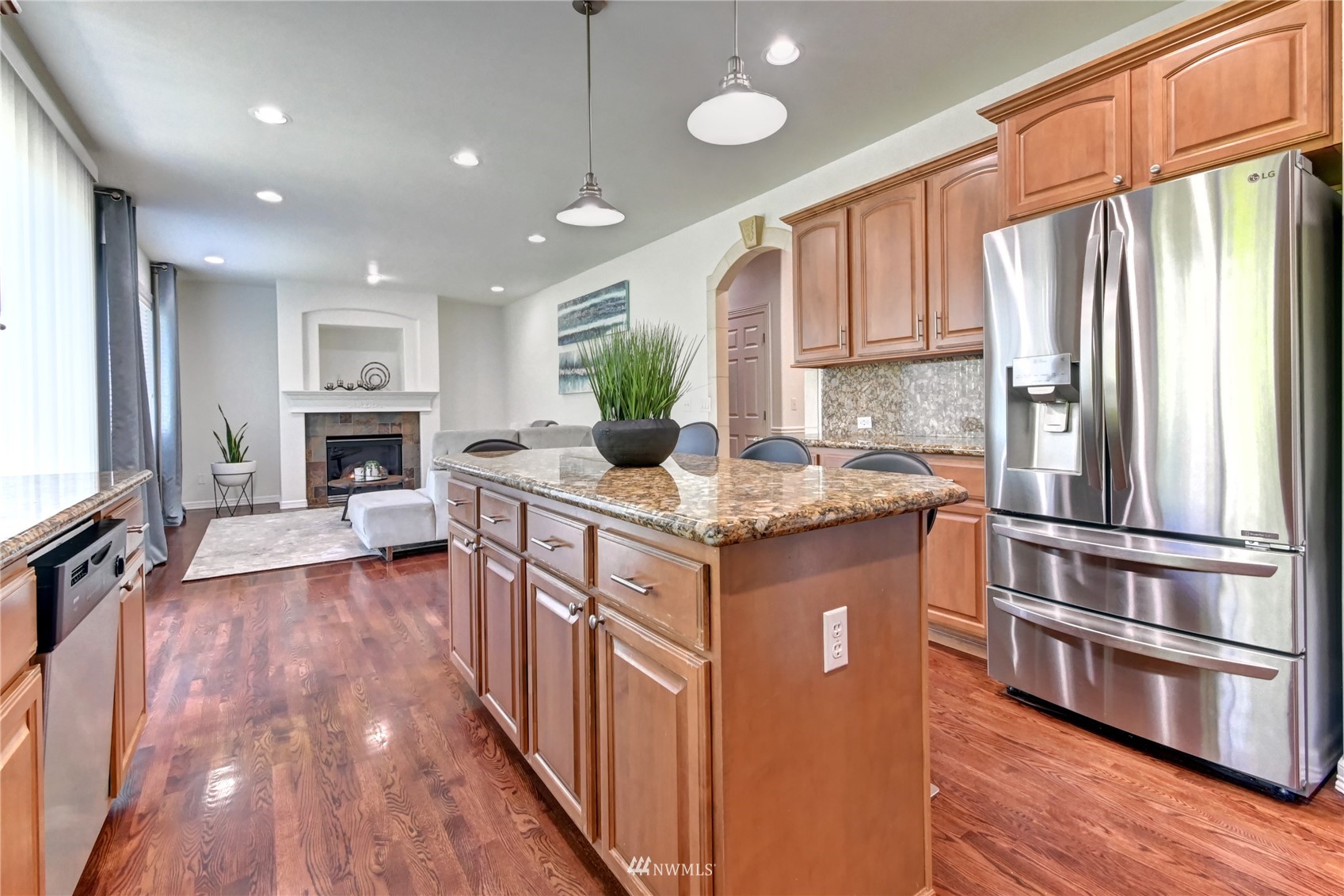 914 Southwest 361st Street Federal Way, WA 98023 - Photo 15 of 40 a kitchen with stainless steel appliances granite countertop a refrigerator a stove and a wooden floors