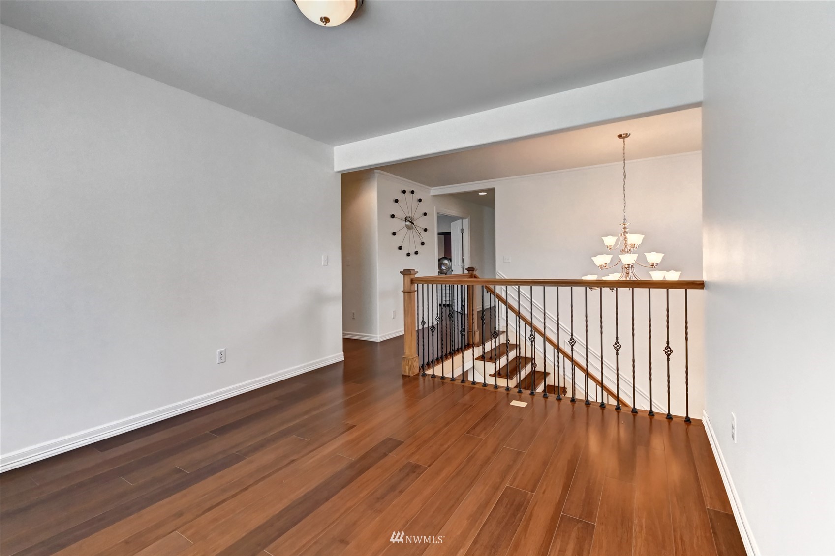 914 Southwest 361st Street Federal Way, WA 98023 - Photo 20 of 40 a view of a hallway with wooden floor stairs and a chandelier