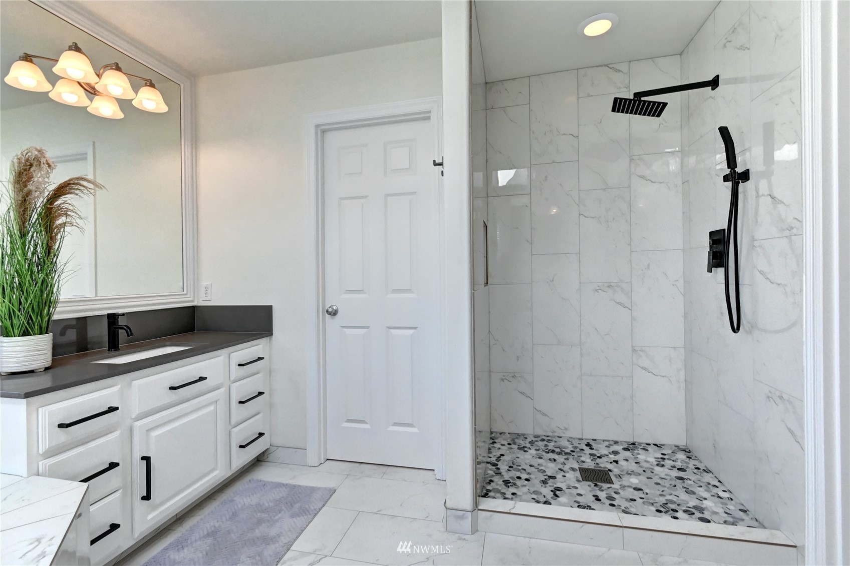 914 Southwest 361st Street Federal Way, WA 98023 - Photo 25 of 40 a bathroom with a shower and a sink