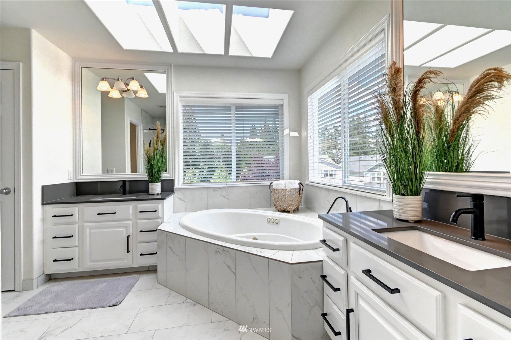 914 Southwest 361st Street Federal Way, WA 98023 - Photo 26 of 40 a spacious bathroom with a granite countertop sink and a large mirror
