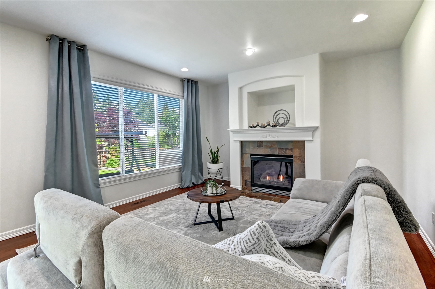 914 Southwest 361st Street Federal Way, WA 98023 - Photo 10 of 40 a living room with furniture and a fireplace