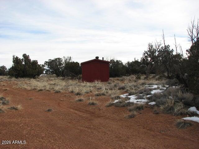 98-99 Chevelon Canyon Ranch, Unit 98 & 99 Heber, AZ 85928 - Photo 2 of 13 a view of a dry yard with a barn