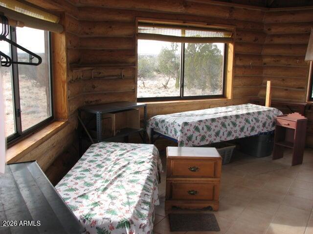 98-99 Chevelon Canyon Ranch, Unit 98 & 99 Heber, AZ 85928 - Photo 10 of 13 a bedroom with a bed and a window