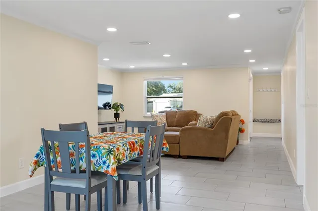a kitchen with a stove sink and cabinets