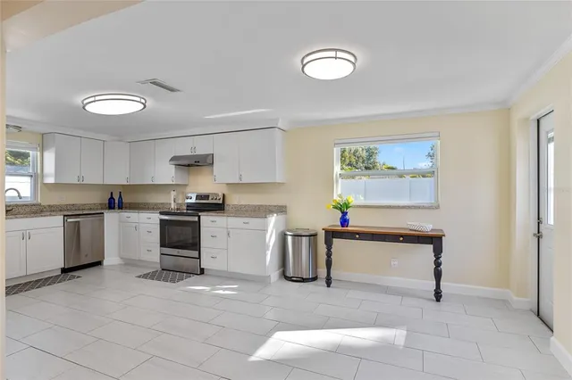 a view of a room with furniture and air conditioner vent