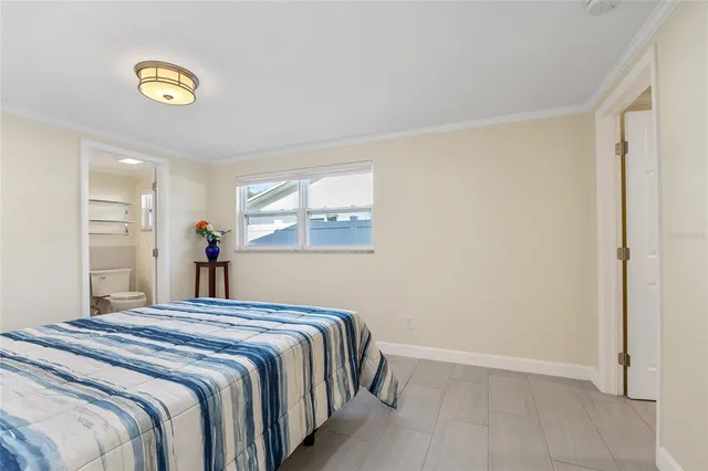 a view of a bedroom with a furniture and closet