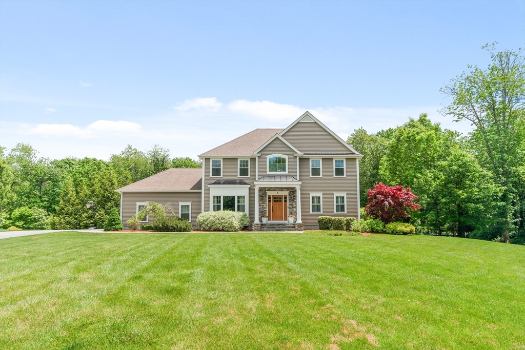 5 Clinton Drive Rehoboth, MA 02769 - Photo 1 of 37 a front view of a house with garden