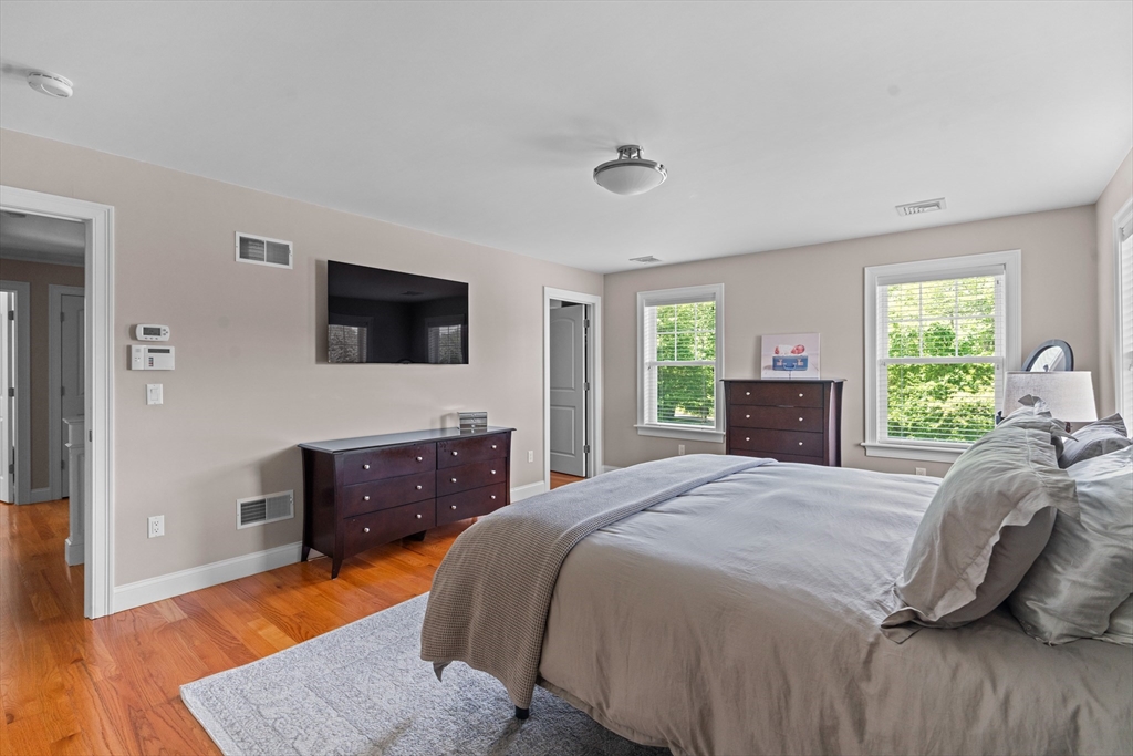 5 Clinton Drive Rehoboth, MA 02769 - Photo 14 of 37 a bedroom with a bed and wooden floor