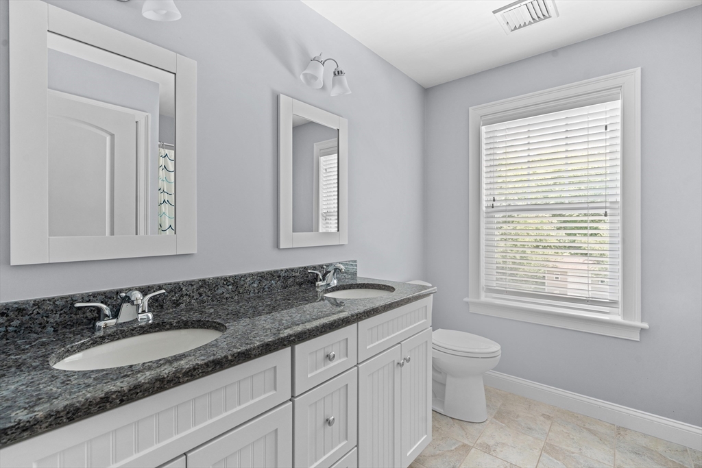 5 Clinton Drive Rehoboth, MA 02769 - Photo 20 of 37 a bathroom with double sink and a mirror