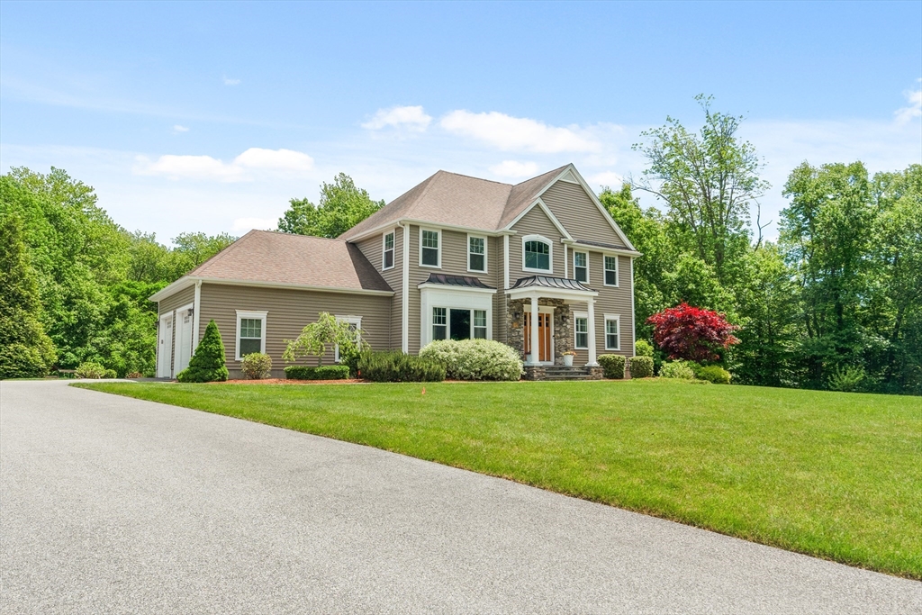 5 Clinton Drive Rehoboth, MA 02769 - Photo 2 of 37 a front view of a house with garden
