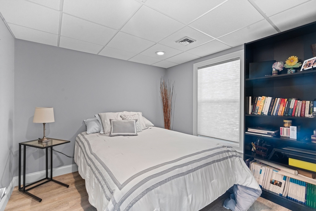 5 Clinton Drive Rehoboth, MA 02769 - Photo 24 of 37 a bedroom with a bed and a flat screen tv