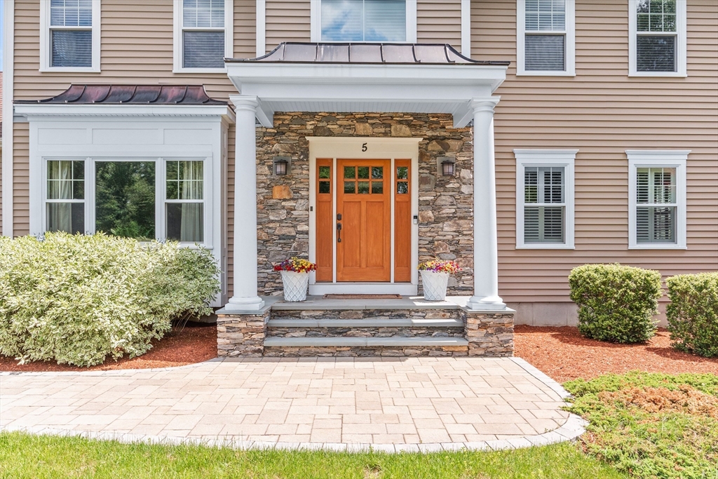 5 Clinton Drive Rehoboth, MA 02769 - Photo 3 of 37 a front view of a house with garden