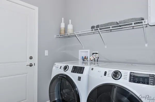 a utility room with dryer and washer
