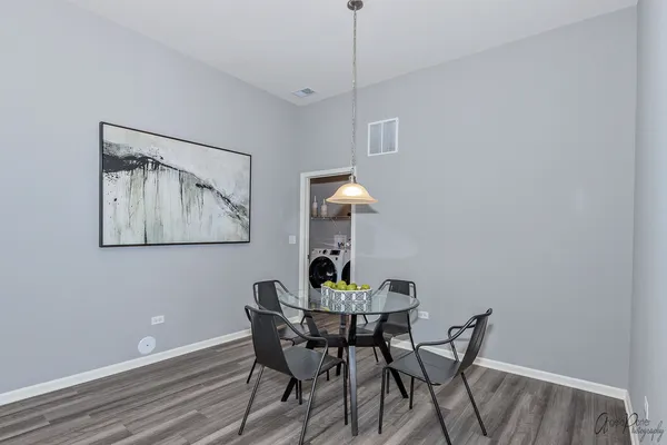 a dining room with furniture and window