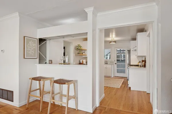 a kitchen with a sink stove and cabinets