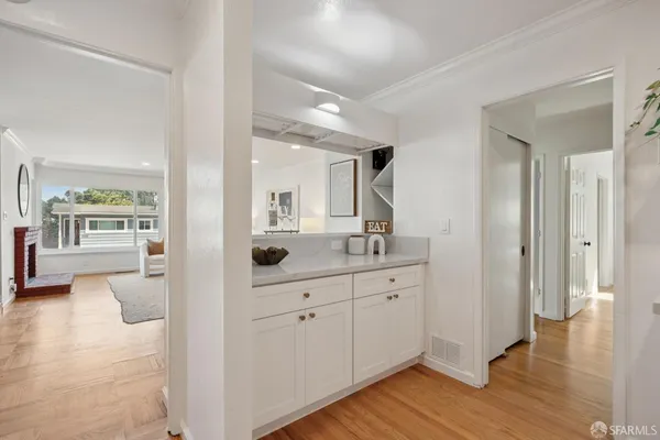 a bedroom with bed and a large window