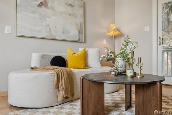 a bedroom with bed and wooden floor