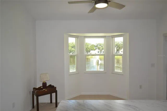 a view of a livingroom with furniture and window