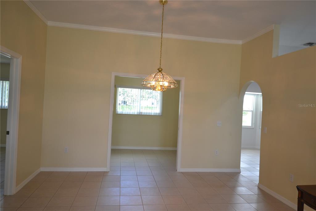 4020 Casa Del Sol Way New Port Richey, FL 34655 - Photo 18 of 98 a view of a room with wooden floor and white walls