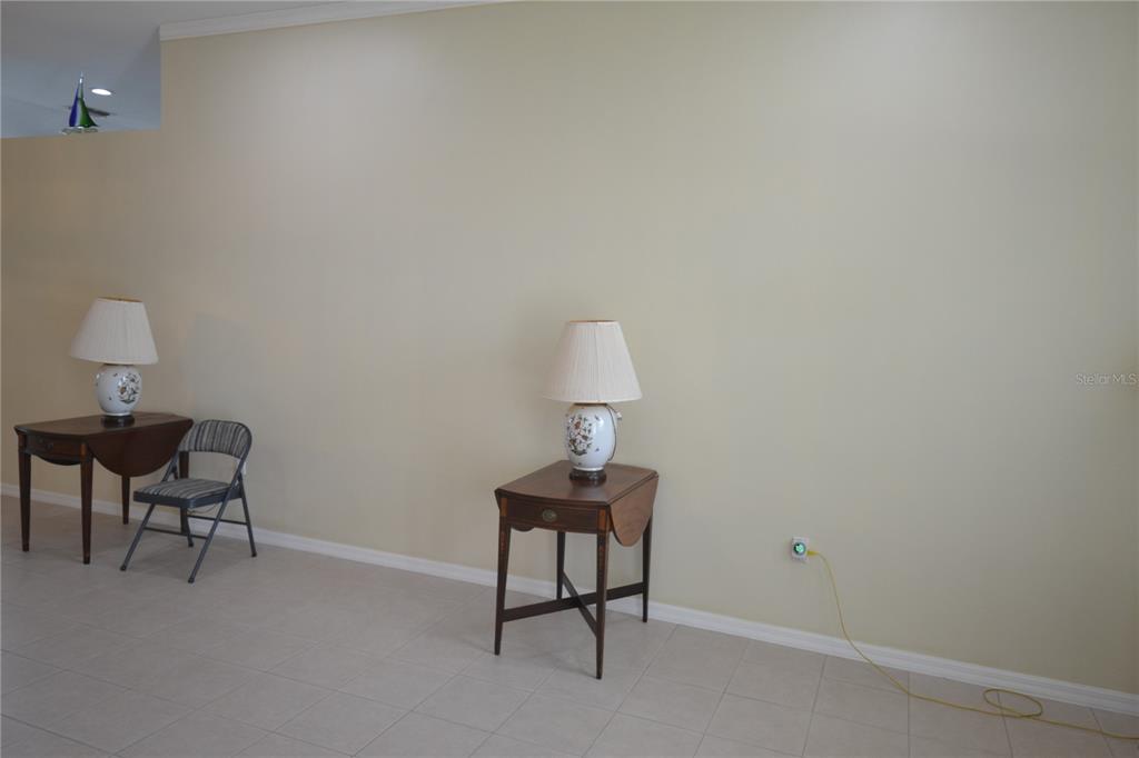 4020 Casa Del Sol Way New Port Richey, FL 34655 - Photo 24 of 98 a room with a table and a chair