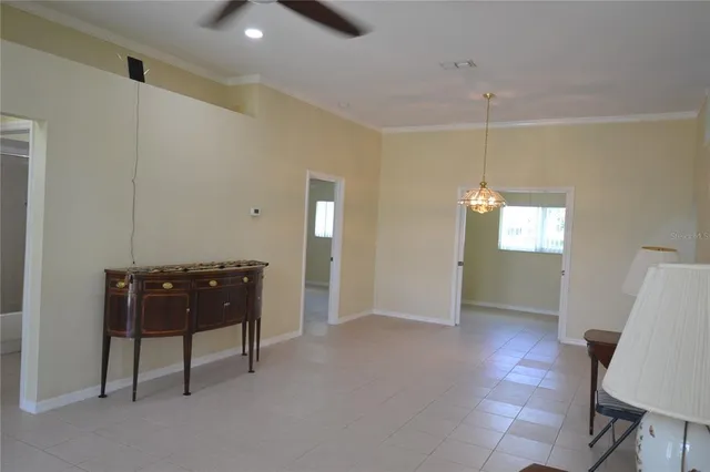 a view of an empty room with windows