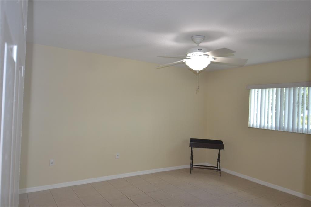 4020 Casa Del Sol Way New Port Richey, FL 34655 - Photo 32 of 98 an empty room with a window and a fan