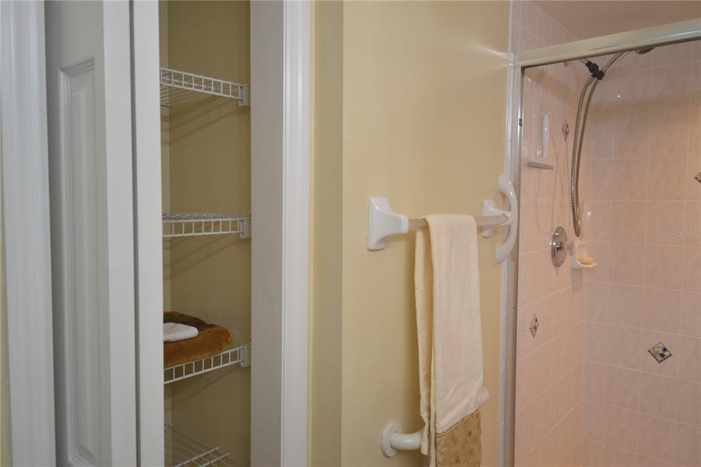 4020 Casa Del Sol Way New Port Richey, FL 34655 - Photo 35 of 98 a bathroom with a glass shower door