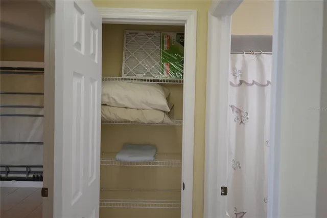a bathroom with a granite countertop sink toilet and a mirror