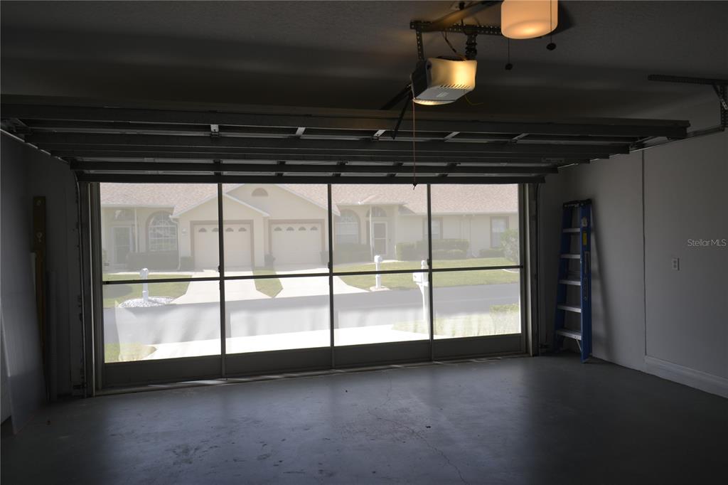 4020 Casa Del Sol Way New Port Richey, FL 34655 - Photo 75 of 98 a view of an empty room with wooden floor and a window