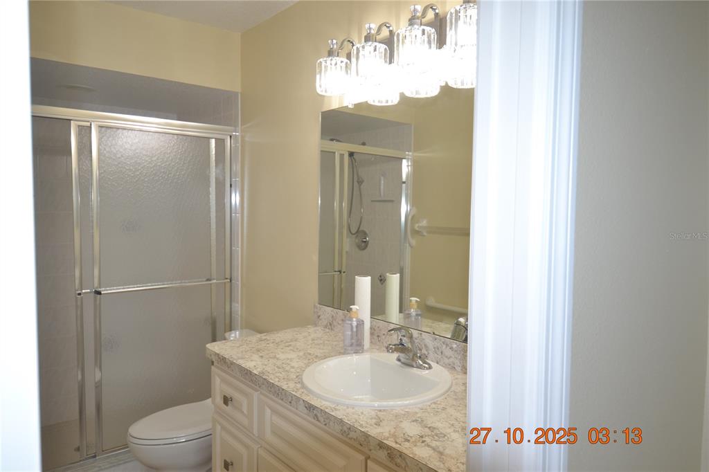 4020 Casa Del Sol Way New Port Richey, FL 34655 - Photo 97 of 98 a bathroom with a granite countertop sink toilet and a mirror