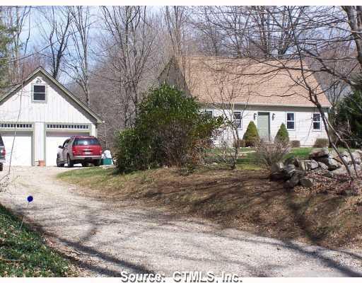 Exterior Front. Charming country cape nestled in on a private acre of land.
