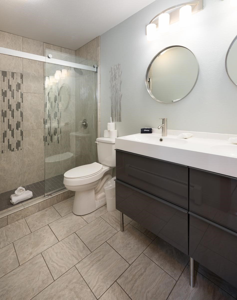 91100 Ryan Gulch Road, Unit 91105 Silverthorne, CO 80498 - Photo 21 of 49 a bathroom with a toilet sink and mirror