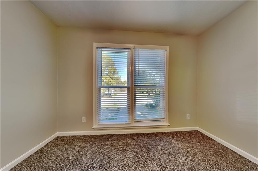 204 Leighs Grove Court Grayson, GA 30017 - Photo 16 of 23 a view of an empty room with a window