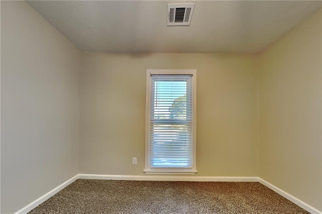 204 Leighs Grove Court Grayson, GA 30017 - Photo 18 of 23 a view of empty room with window