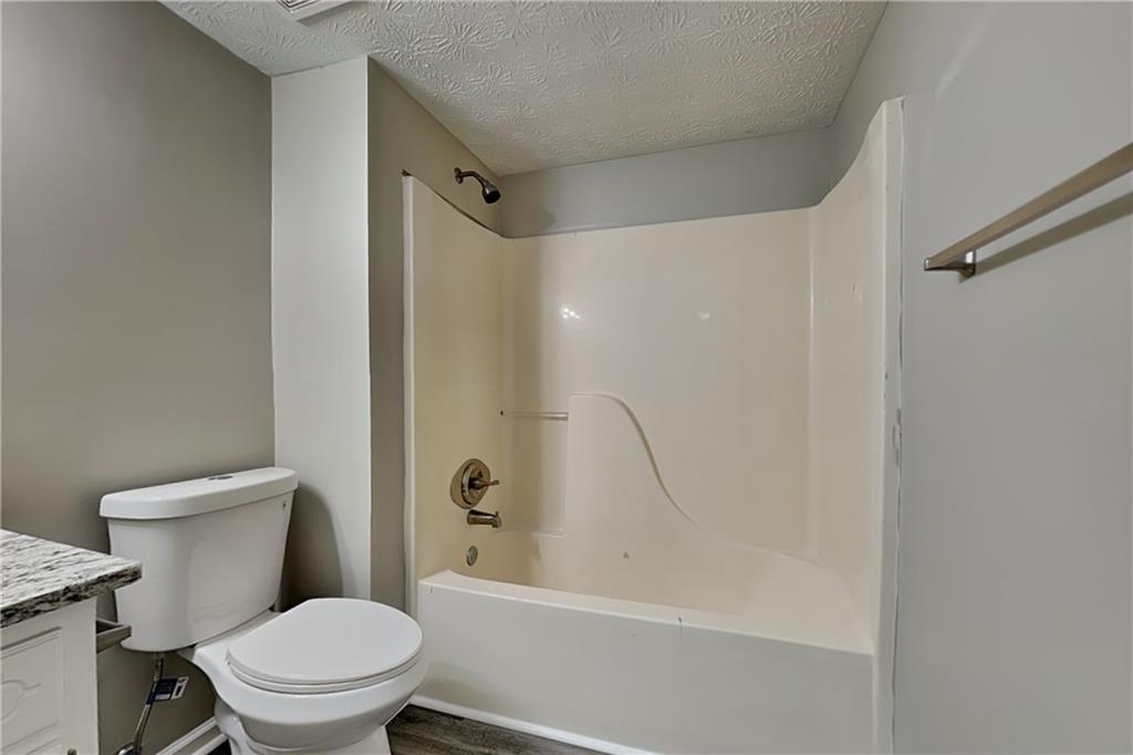 204 Leighs Grove Court Grayson, GA 30017 - Photo 20 of 23 a white toilet sitting next to a bath tub