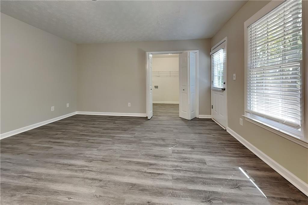 204 Leighs Grove Court Grayson, GA 30017 - Photo 5 of 23 a view of an empty room and window