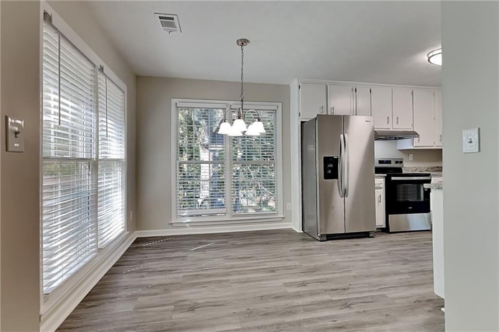 204 Leighs Grove Court Grayson, GA 30017 - Photo 6 of 23 a kitchen with stainless steel appliances granite countertop a refrigerator and a sink