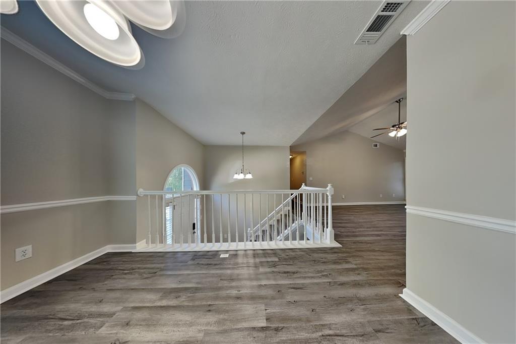 204 Leighs Grove Court Grayson, GA 30017 - Photo 9 of 23 a view of empty room with wooden floor