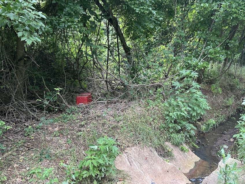 0 David Street Marshall, TX 75670 - Photo 2 of 2 a backyard of a house with red umbrella