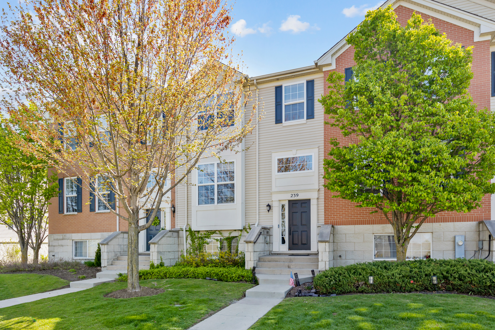 front view of a house with a yard
