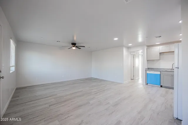 a kitchen with a refrigerator sink and microwave