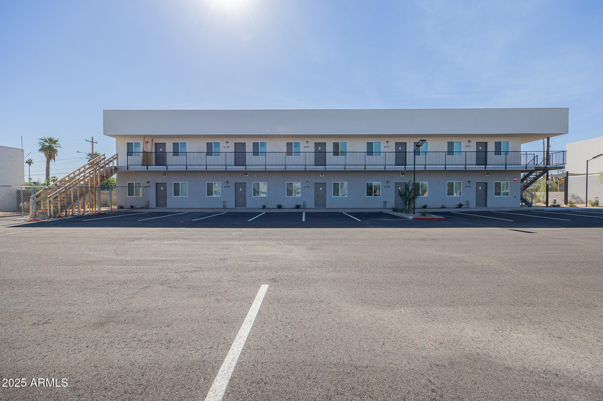 2121 West Adams Street, Unit B102 Phoenix, AZ 85009 - Photo 4 of 25 a living room with a couch and a bookshelf