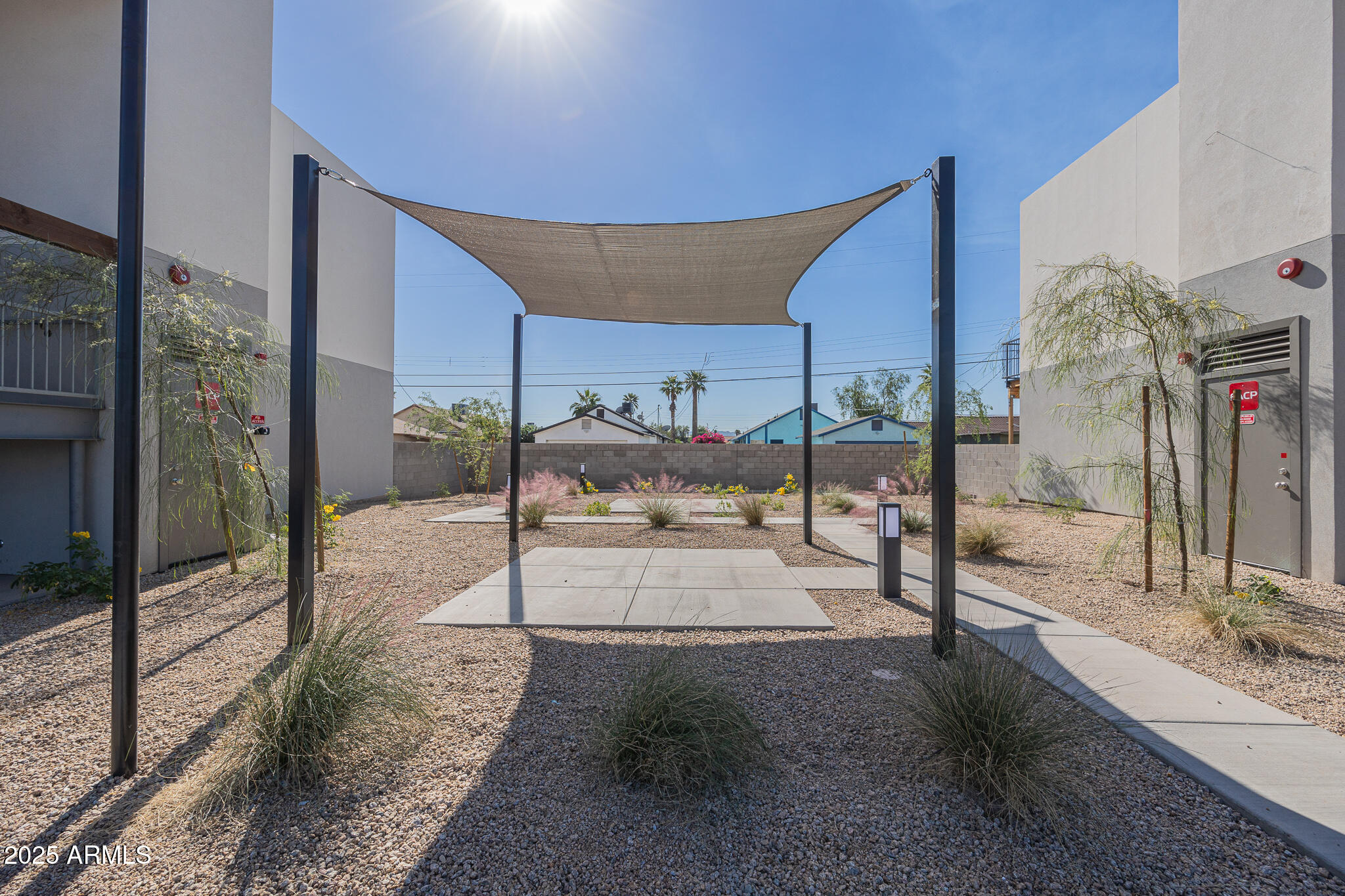 2121 West Adams Street, Unit B102 Phoenix, AZ 85009 - Photo 8 of 25 a view of a building with a street