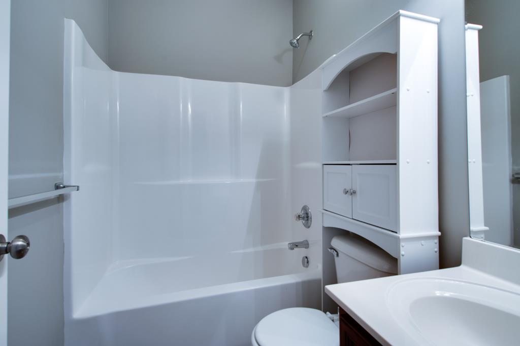 583 Neelys Bend Road Madison, TN 37115 - Photo 16 of 23 The hallway bathroom between bedrooms two and three with crisp finishes.
