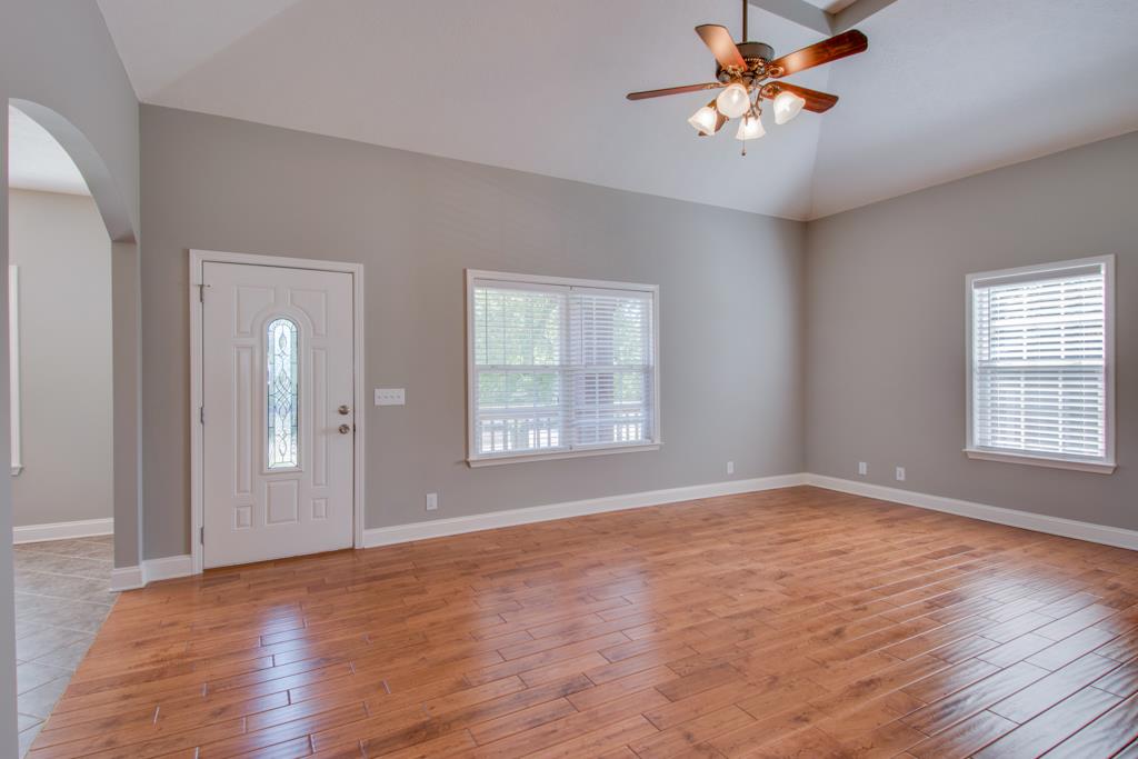 583 Neelys Bend Road Madison, TN 37115 - Photo 9 of 23 The living room is flooded with natural light and also features new hand scraped hardwood floors!