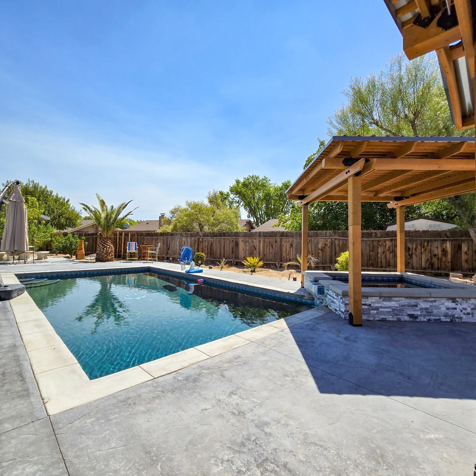 316 South Lilac Street Ridgecrest, CA 93555 - Photo 41 of 45 a view of a swimming pool with lounge chair